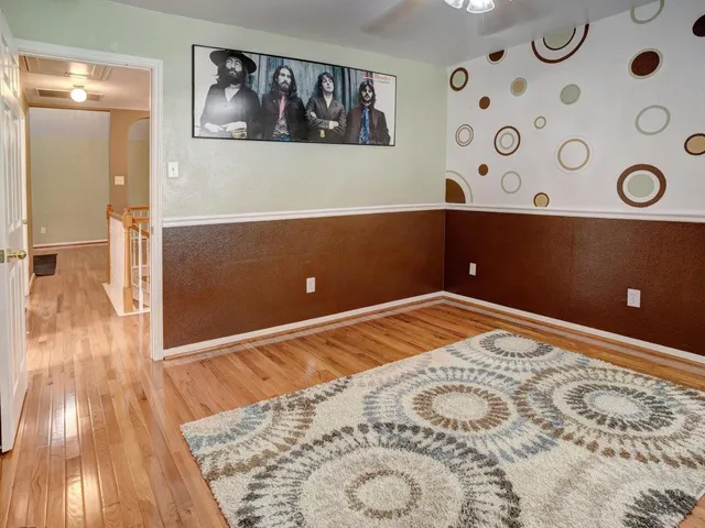a bathroom with a sink a toilet and a window