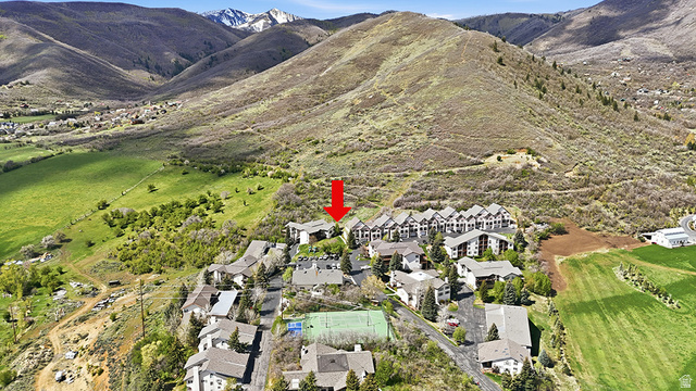 1041 West Grindelwald Court, Unit R5 Midway, UT 84049 - Photo 34 of 44 Midway condo for sale aerial with trail system, green space, and mountain views in background. Highlights the connection between the community and nearby trails.