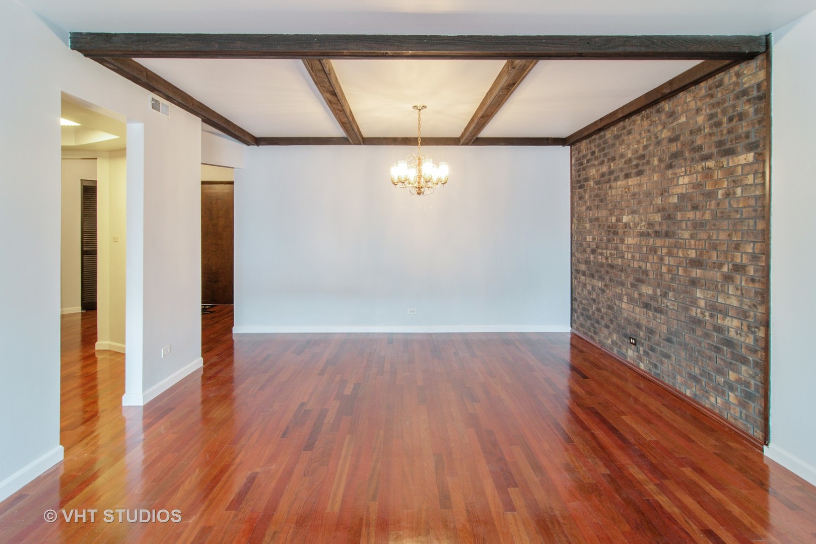 475 Shenstone Road, Unit 102 Riverside, IL 60546 - Photo 6 of 15 a view of empty room with wooden floor and fan