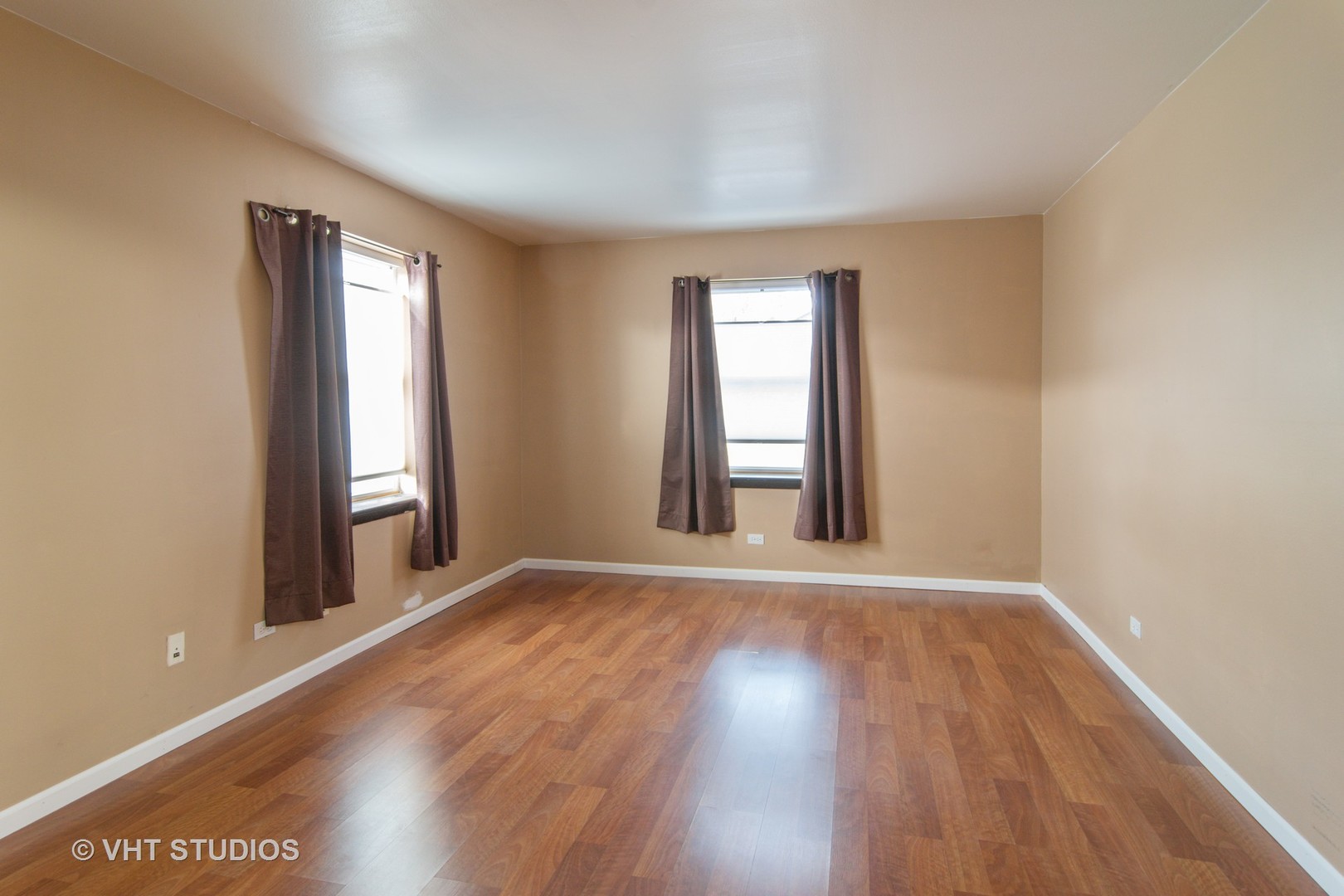 475 Shenstone Road, Unit 102 Riverside, IL 60546 - Photo 7 of 15 an empty room with wooden floor and windows