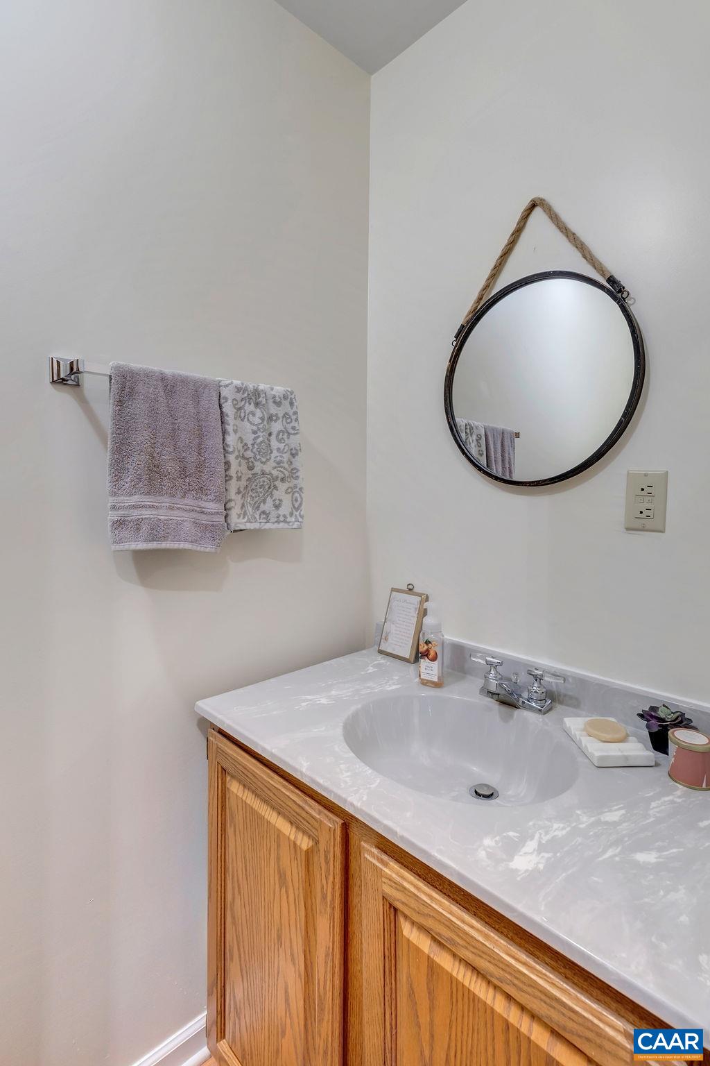 454 Pine Bluff Road Ruckersville, VA 22968 - Photo 17 of 69 a bathroom with a sink and a mirror