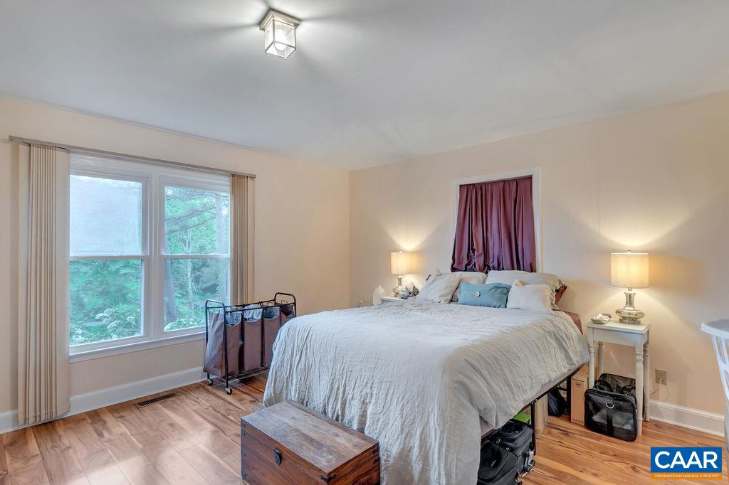 454 Pine Bluff Road Ruckersville, VA 22968 - Photo 20 of 69 a bedroom with a bed and a large window