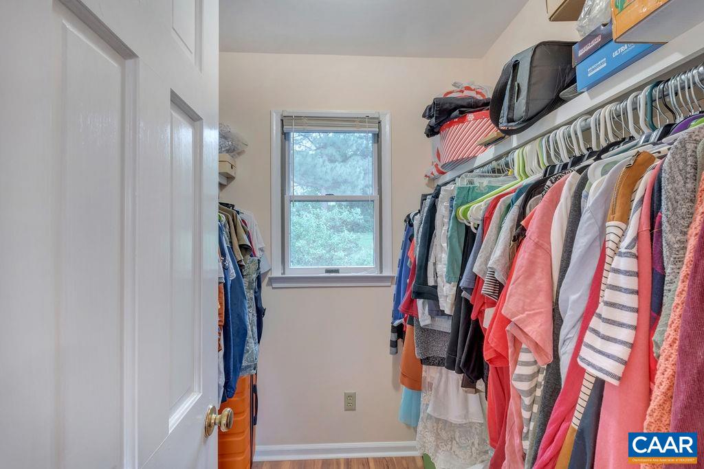454 Pine Bluff Road Ruckersville, VA 22968 - Photo 21 of 69 a view of walk in closet with clothes and shoes
