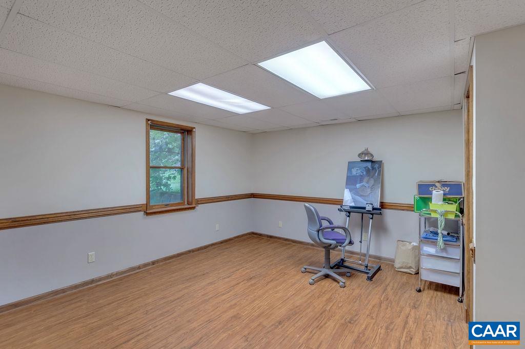 454 Pine Bluff Road Ruckersville, VA 22968 - Photo 31 of 69 a view of a room with gym equipment and a window