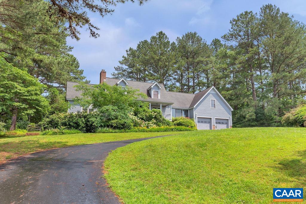 454 Pine Bluff Road Ruckersville, VA 22968 - Photo 43 of 69 a view of a house with a big yard and palm trees