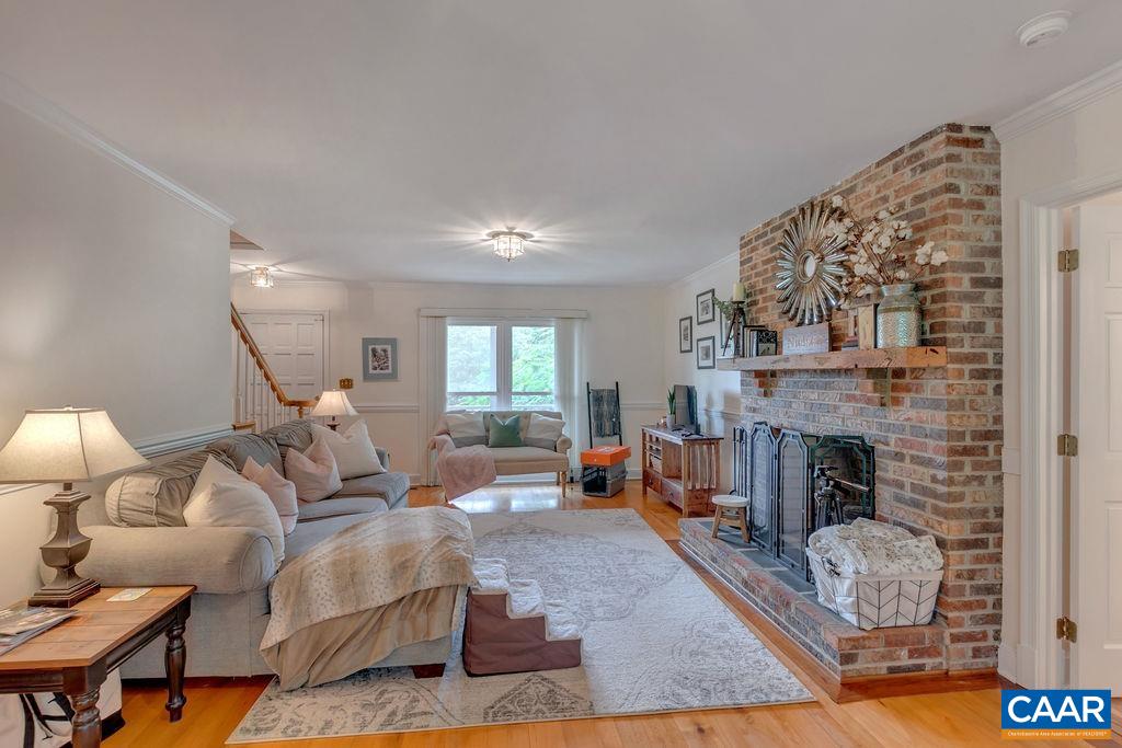 454 Pine Bluff Road Ruckersville, VA 22968 - Photo 6 of 69 a living room with furniture and a fireplace