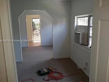 Brownsville Miami, FL 33142 - Photo 2 of 2 a room that has a window and cabinets