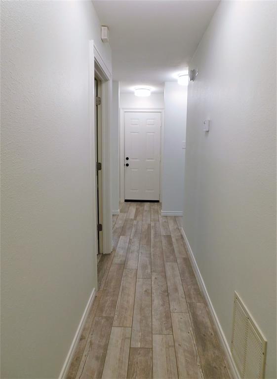 2001 Oak Tree Drive Denton, TX 76209 - Photo 19 of 34 a view of a room with wooden floor