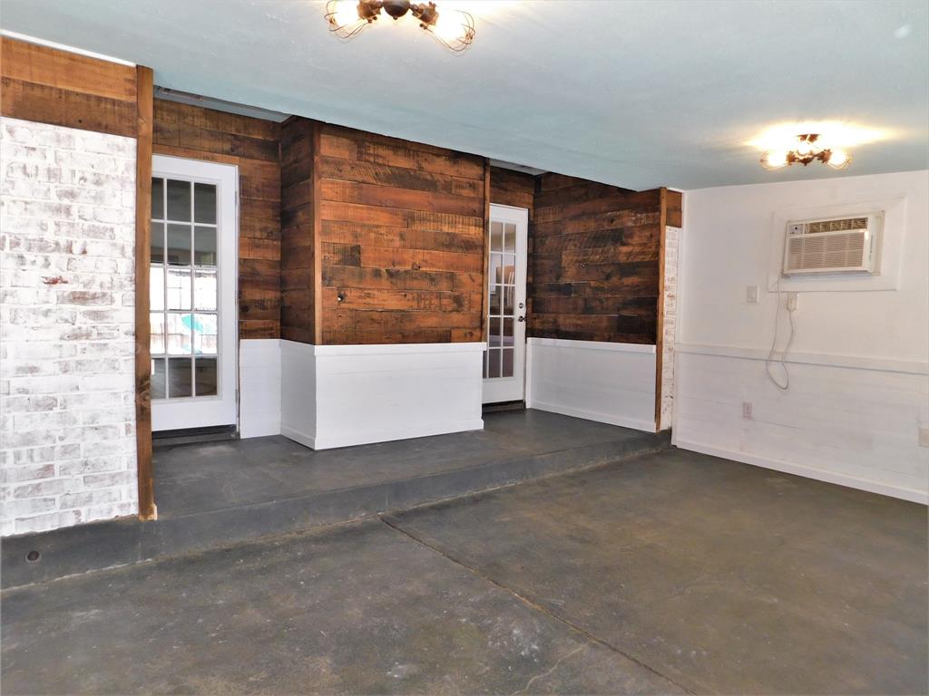 2001 Oak Tree Drive Denton, TX 76209 - Photo 26 of 34 wooden floor in an empty room with a window