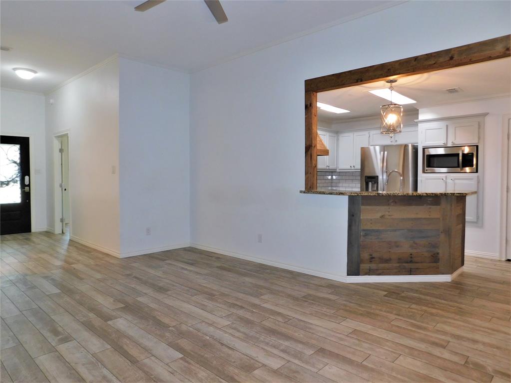 2001 Oak Tree Drive Denton, TX 76209 - Photo 9 of 34 a view of a kitchen cabinets and wooden floor