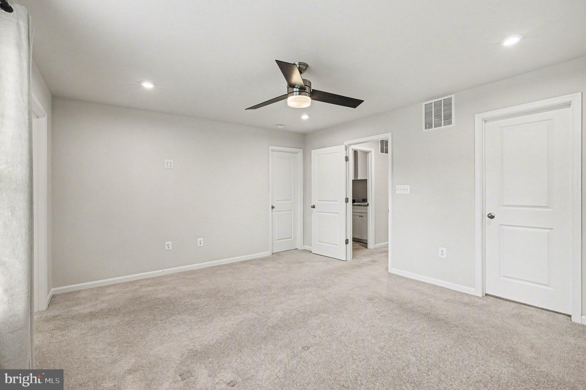 18281 Summit Pointe Drive Triangle, VA 22172 - Photo 12 of 30 a view of an empty room and chandelier fan