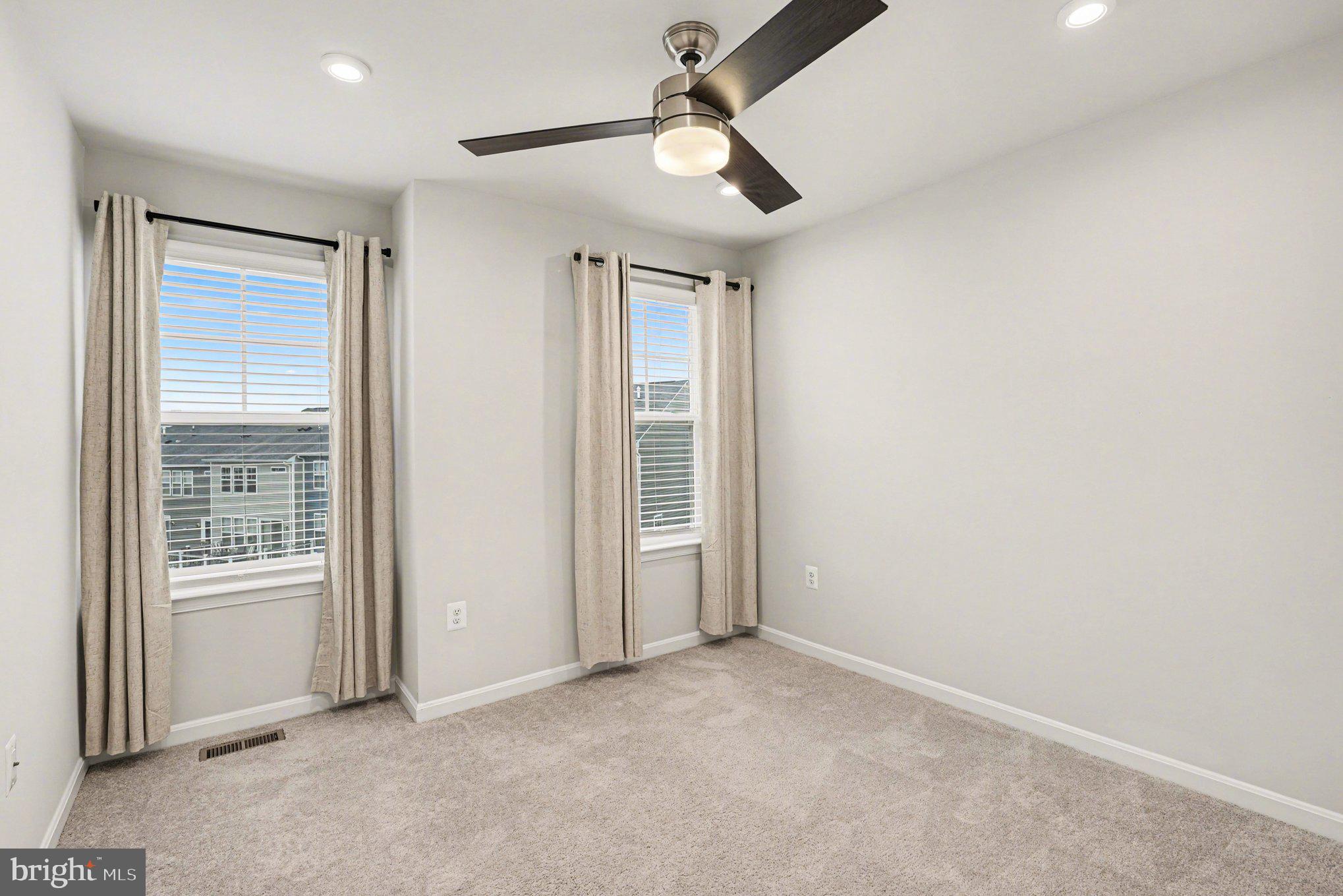 18281 Summit Pointe Drive Triangle, VA 22172 - Photo 16 of 30 an empty room with windows