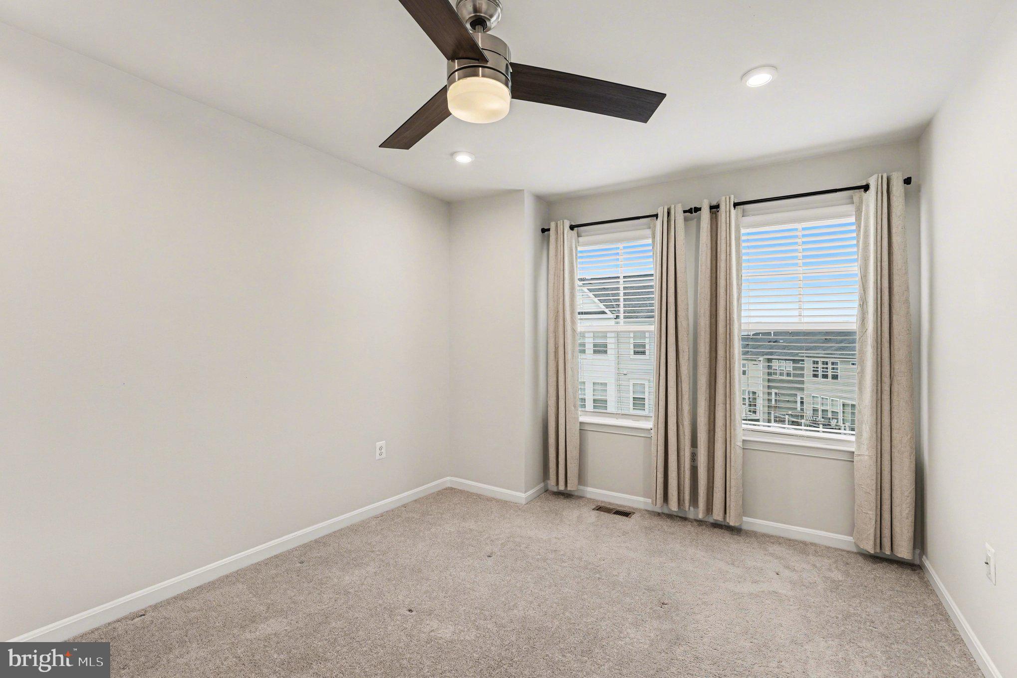 18281 Summit Pointe Drive Triangle, VA 22172 - Photo 19 of 30 an empty room with windows