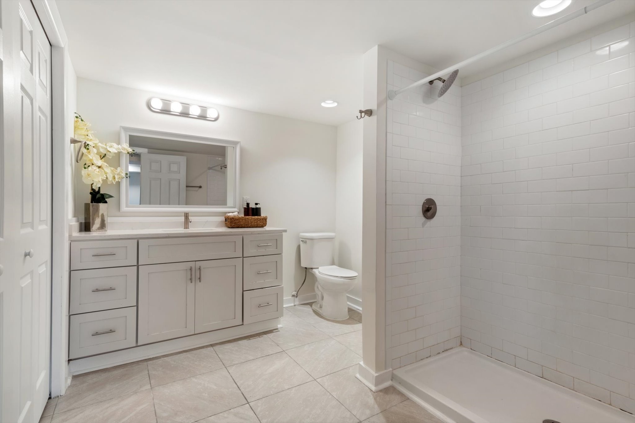 828 Irma Drive Antioch, TN 37013 - Photo 20 of 23 a spacious bathroom with a shower a sink and a mirror