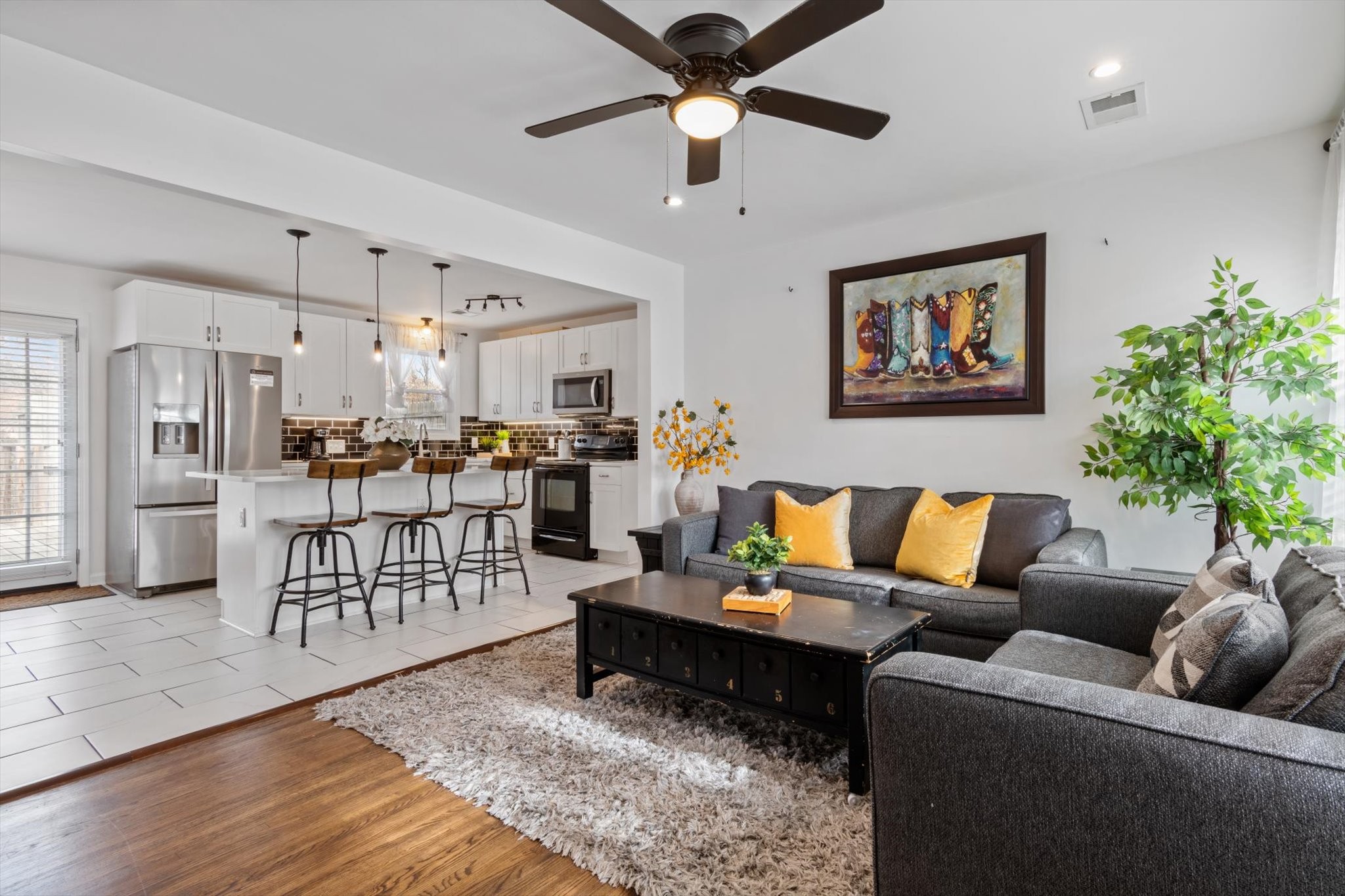 828 Irma Drive Antioch, TN 37013 - Photo 6 of 23 a living room with furniture kitchen view and a potted plant