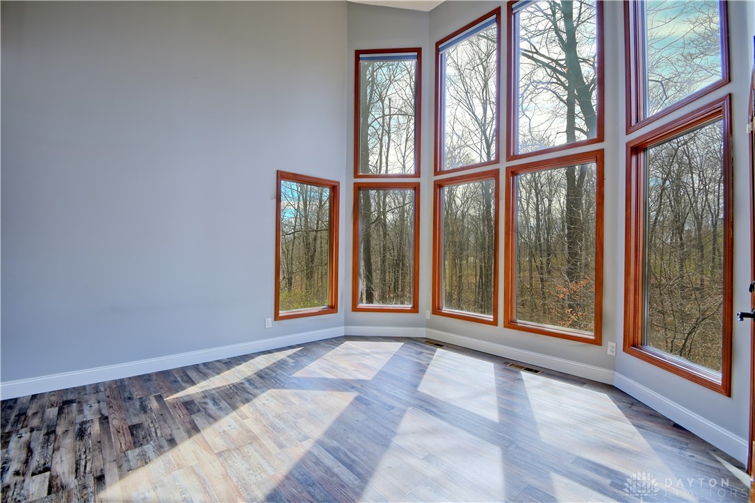8711 Nicole Lane Springboro, OH 45066 - Photo 19 of 87 This bright room features large windows with serene views of the surrounding nature.