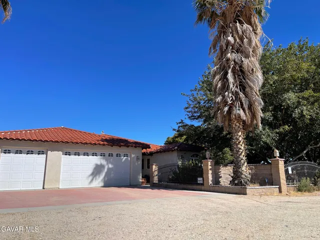 a view of a house with a snow in the yard