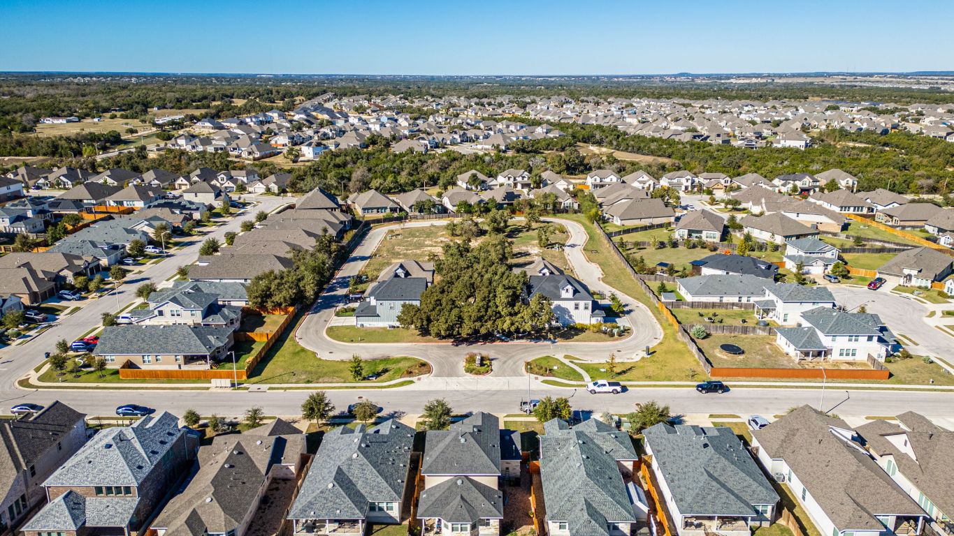 1301 Low Branch Lane, Unit 3 Leander, TX 78641 - Photo 11 of 38 an aerial view of residential houses with outdoor space