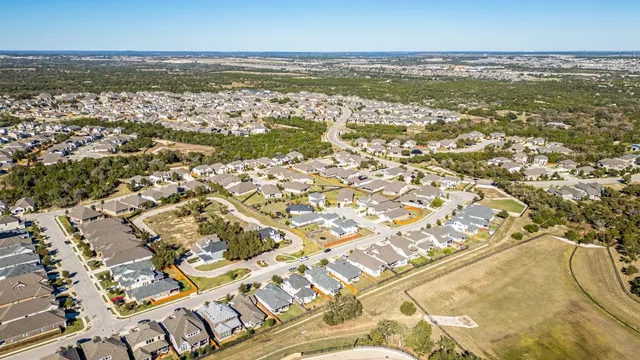 an aerial view of residential building with ocean view