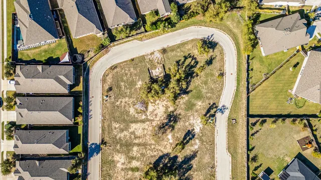 an aerial view of residential building and ocean