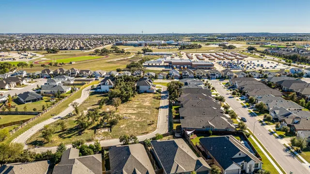 an aerial view of residential building and parking space