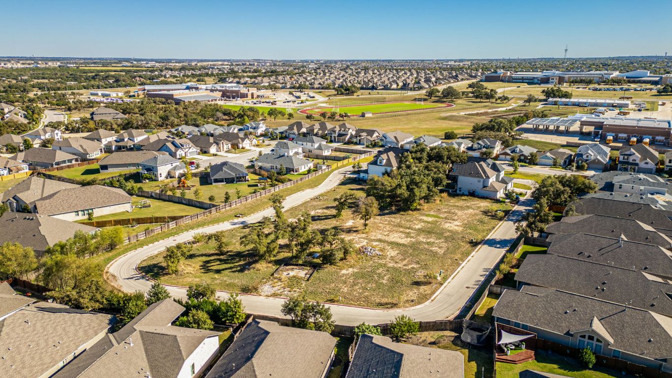 1301 Low Branch Lane, Unit 3 Leander, TX 78641 - Photo 25 of 38 an aerial view of residential houses with outdoor space