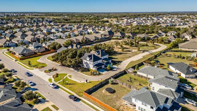 an aerial view of a house with a swimming pool