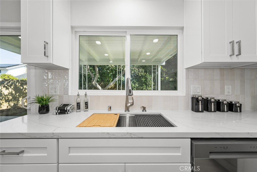11344 Rochelle Street Los Alamitos, CA 90720 - Photo 14 of 55 a kitchen with a sink and large window