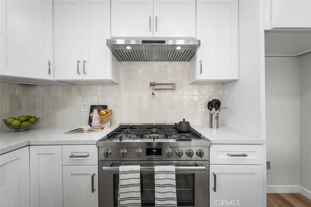 11344 Rochelle Street Los Alamitos, CA 90720 - Photo 15 of 55 a kitchen with a stove and cabinets