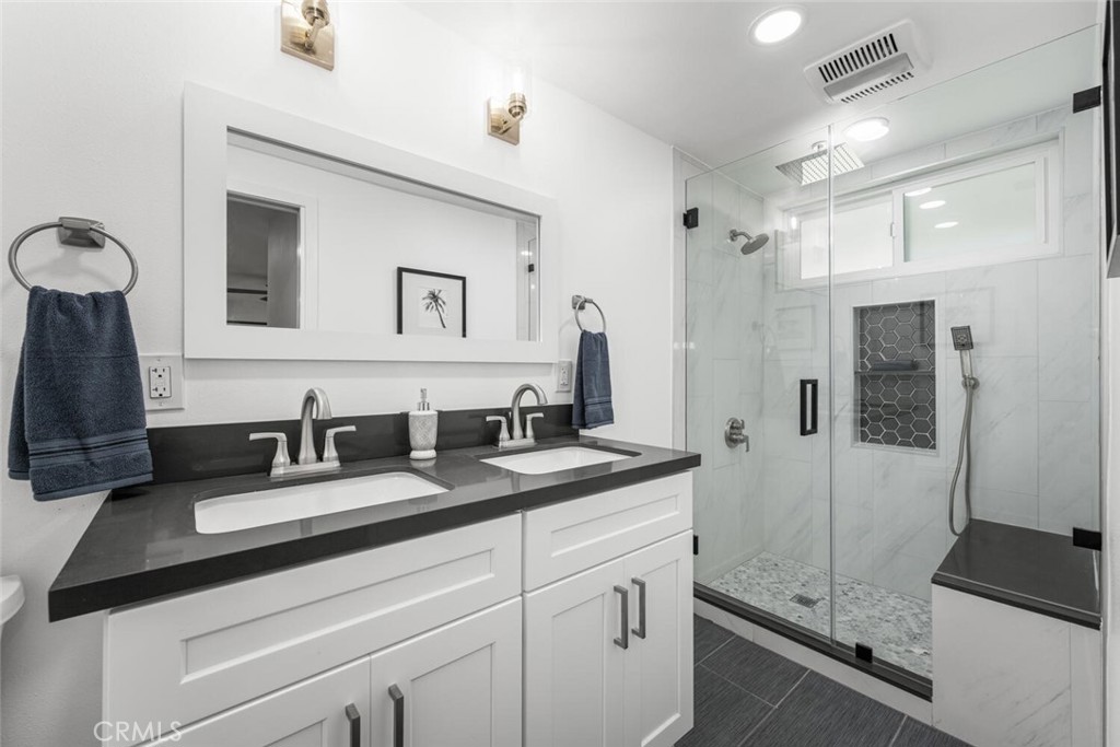 11344 Rochelle Street Los Alamitos, CA 90720 - Photo 24 of 55 a bathroom with a sink and a mirror