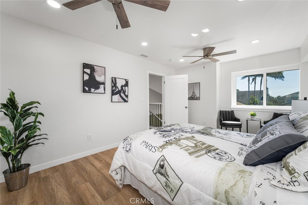 11344 Rochelle Street Los Alamitos, CA 90720 - Photo 29 of 55 a bedroom with a large bed and a potted plant