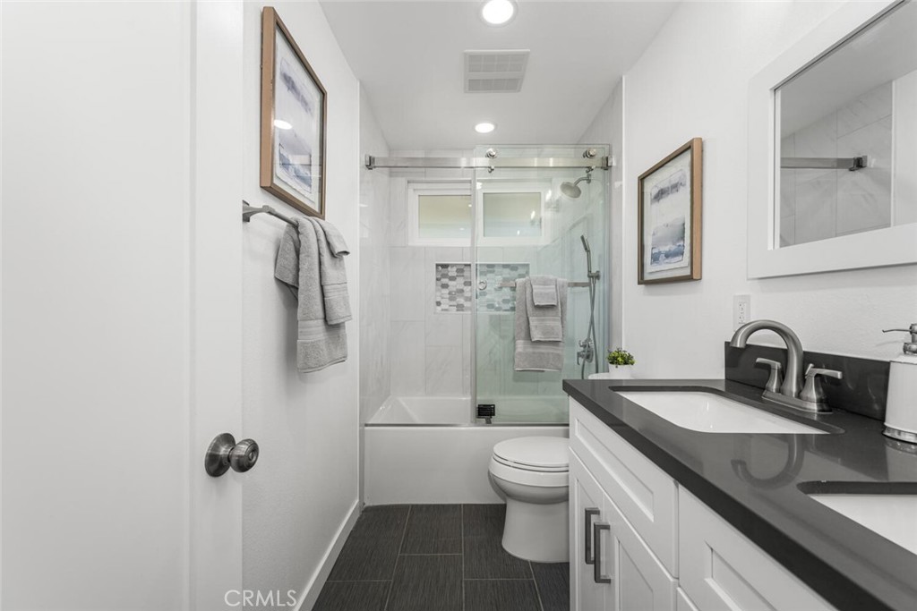 11344 Rochelle Street Los Alamitos, CA 90720 - Photo 32 of 55 a bathroom with a granite countertop sink toilet and shower