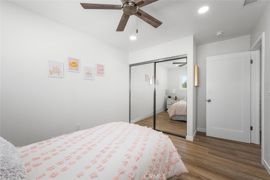 11344 Rochelle Street Los Alamitos, CA 90720 - Photo 36 of 55 a bedroom with a bed and a chandelier