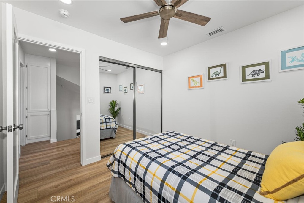 11344 Rochelle Street Los Alamitos, CA 90720 - Photo 39 of 55 a bedroom with a bed and a chandelier