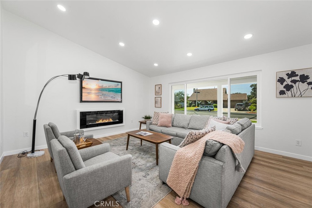 11344 Rochelle Street Los Alamitos, CA 90720 - Photo 6 of 55 a living room with furniture and a fireplace