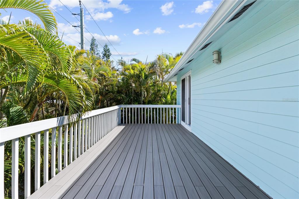 315 Spring Avenue Anna Maria, FL 34216 - Photo 38 of 63 a view of a balcony with wooden floor