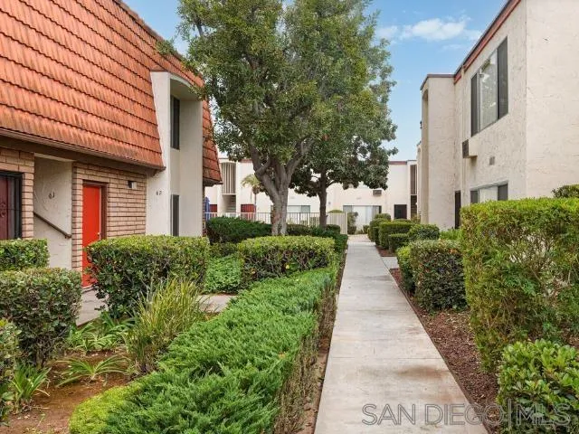 229-45 Shady Lane El Cajon, CA 92021 - Photo 45 of 65 a view of a pathway with house on both side