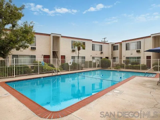 229-45 Shady Lane El Cajon, CA 92021 - Photo 46 of 65 a view of a swimming pool with a lounge chair