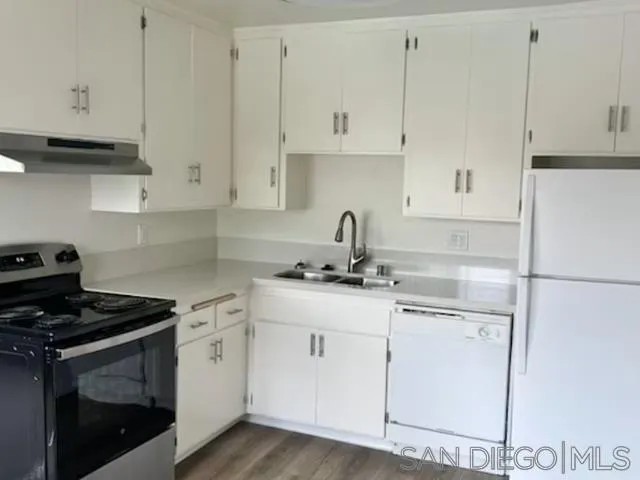229-45 Shady Lane El Cajon, CA 92021 - Photo 52 of 65 a kitchen with cabinets appliances a sink and a stove