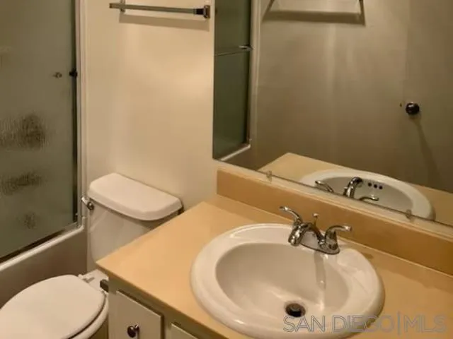 229-45 Shady Lane El Cajon, CA 92021 - Photo 54 of 65 a bathroom with a sink and mirror
