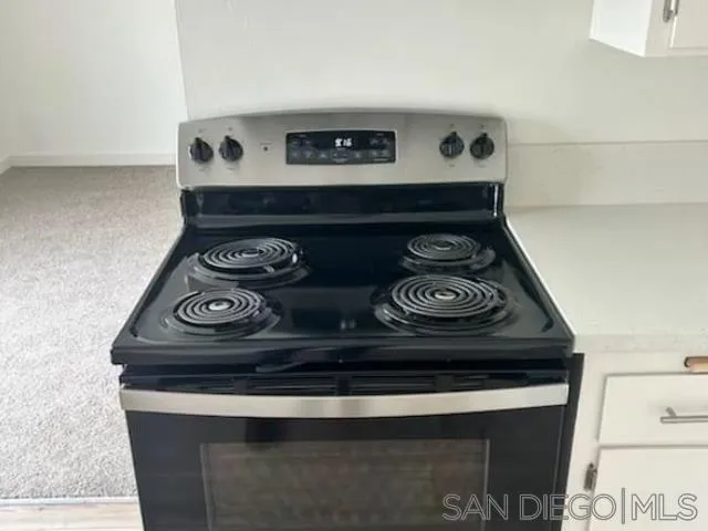 229-45 Shady Lane El Cajon, CA 92021 - Photo 56 of 65 a stove top oven sitting inside of a kitchen