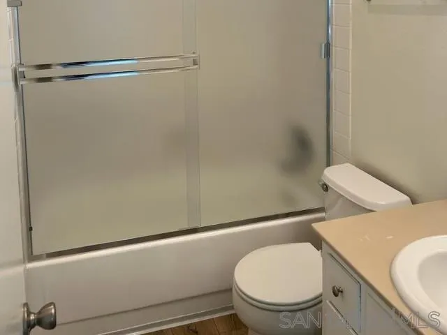229-45 Shady Lane El Cajon, CA 92021 - Photo 57 of 65 a white toilet sitting next to a bathroom sink