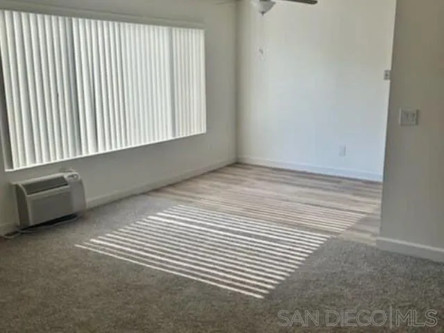 229-45 Shady Lane El Cajon, CA 92021 - Photo 65 of 65 a view of a room with a wooden floor