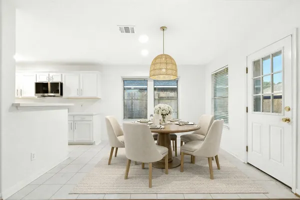 a kitchen with a sink appliances and cabinets