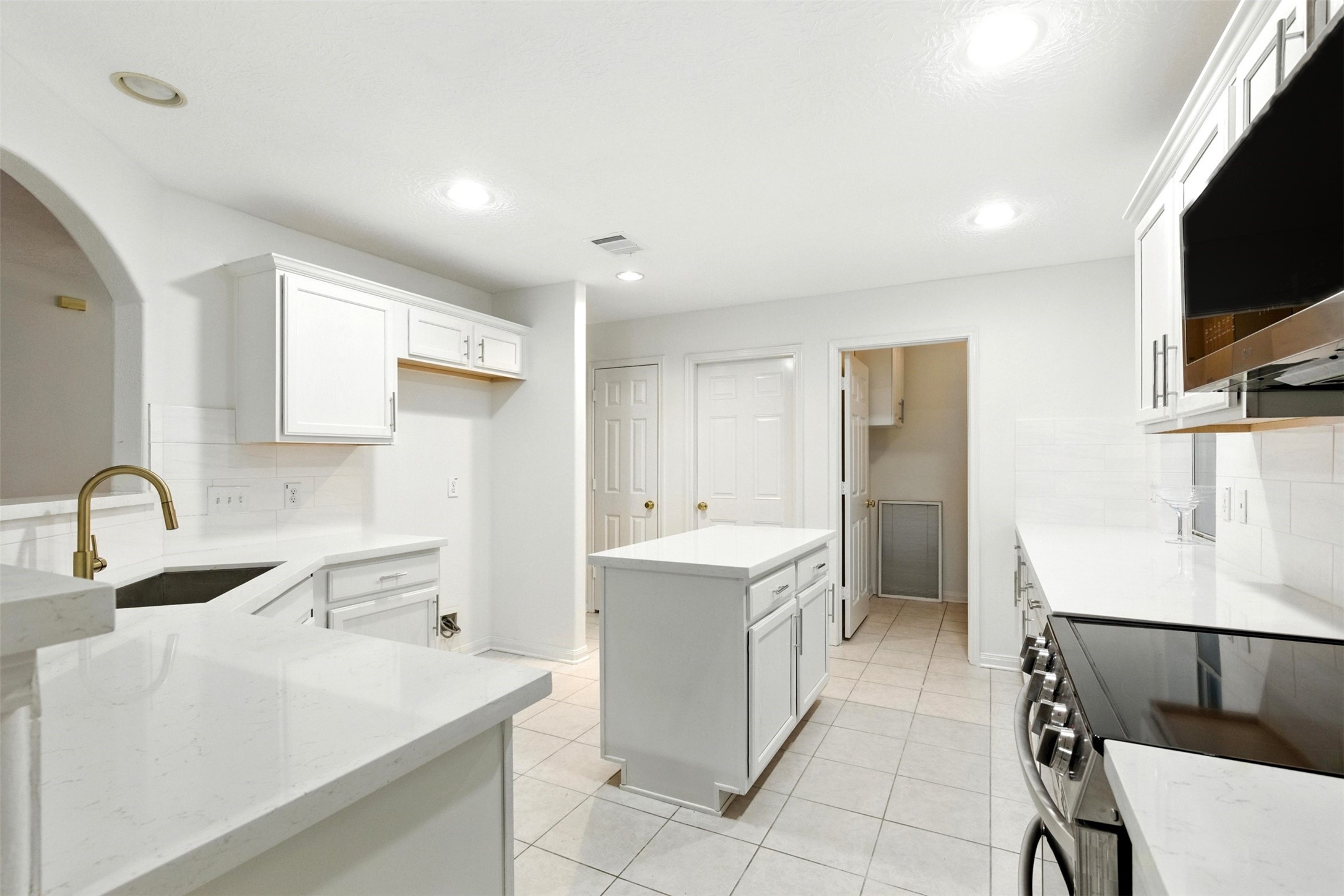 2119 Hannover Way Spring, TX 77388 - Photo 13 of 39 a kitchen with a sink appliances and cabinets