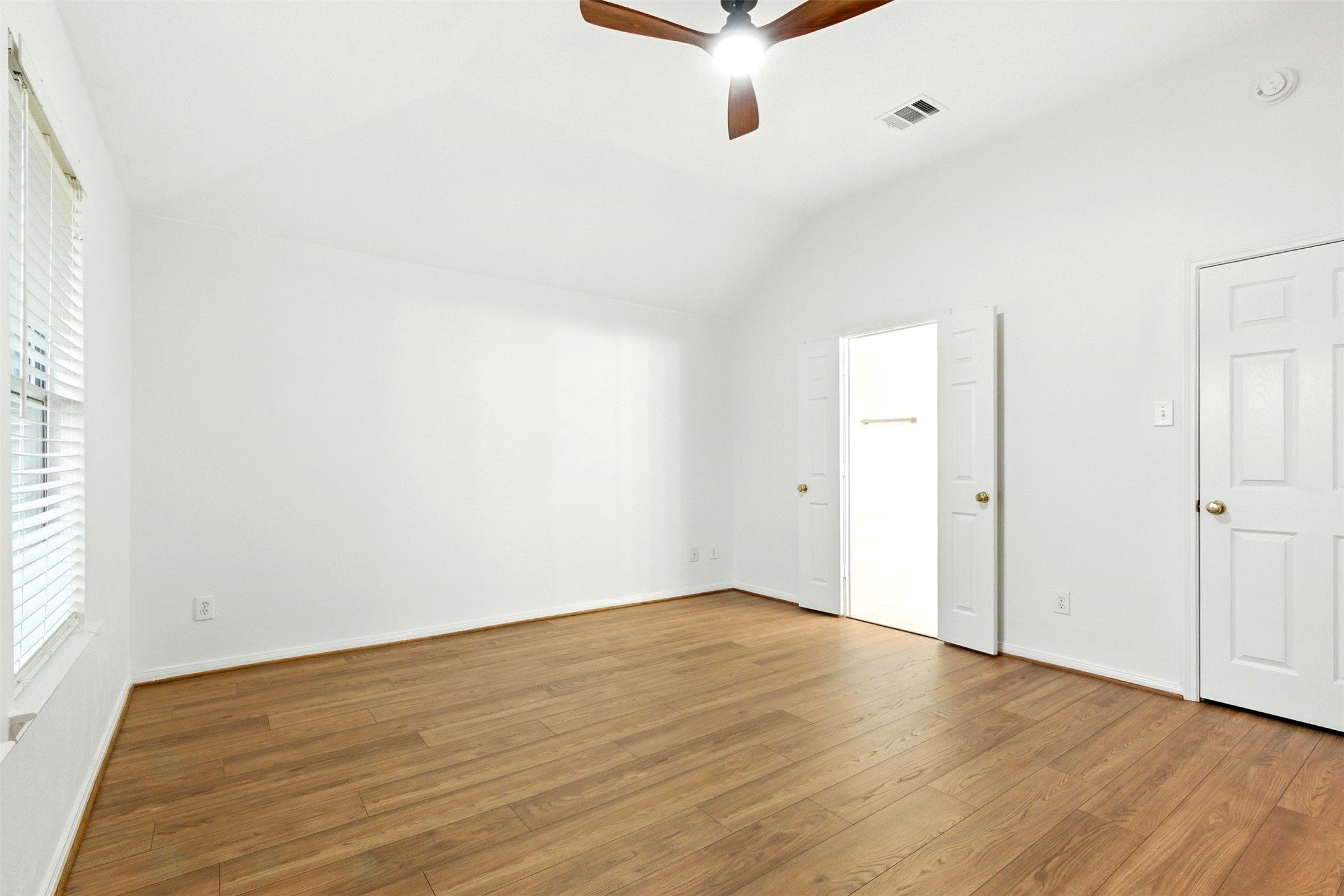2119 Hannover Way Spring, TX 77388 - Photo 17 of 39 an empty room with wooden floor and windows