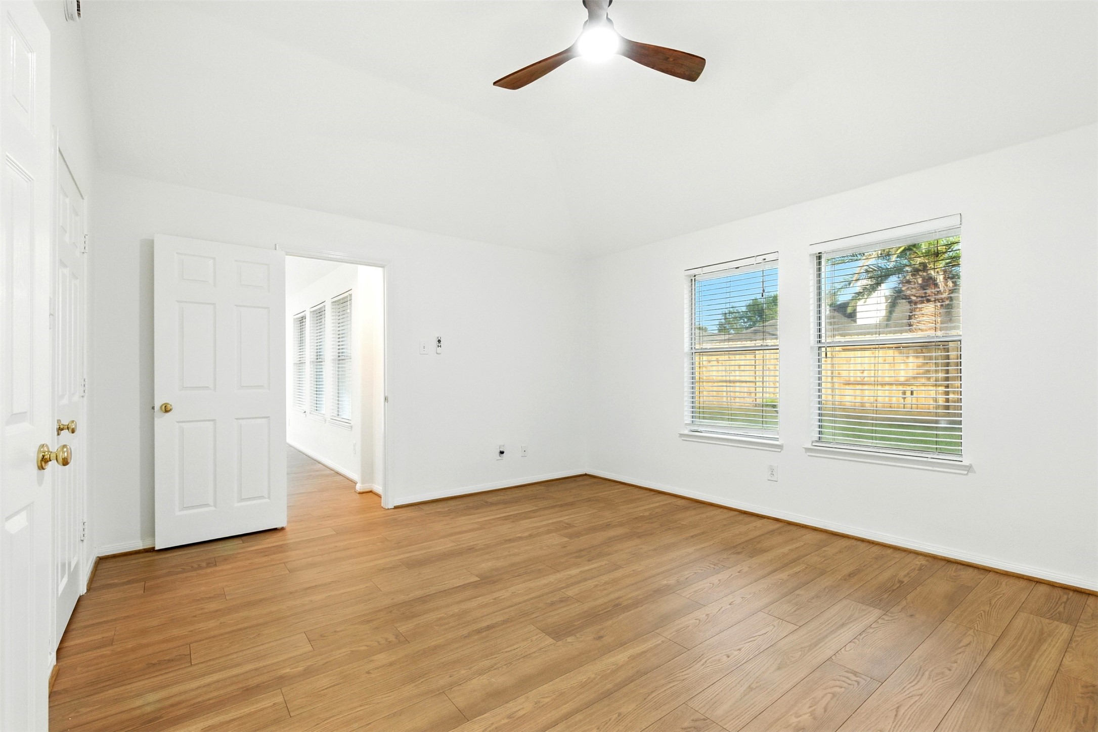 2119 Hannover Way Spring, TX 77388 - Photo 19 of 39 wooden floor in an empty room with a window