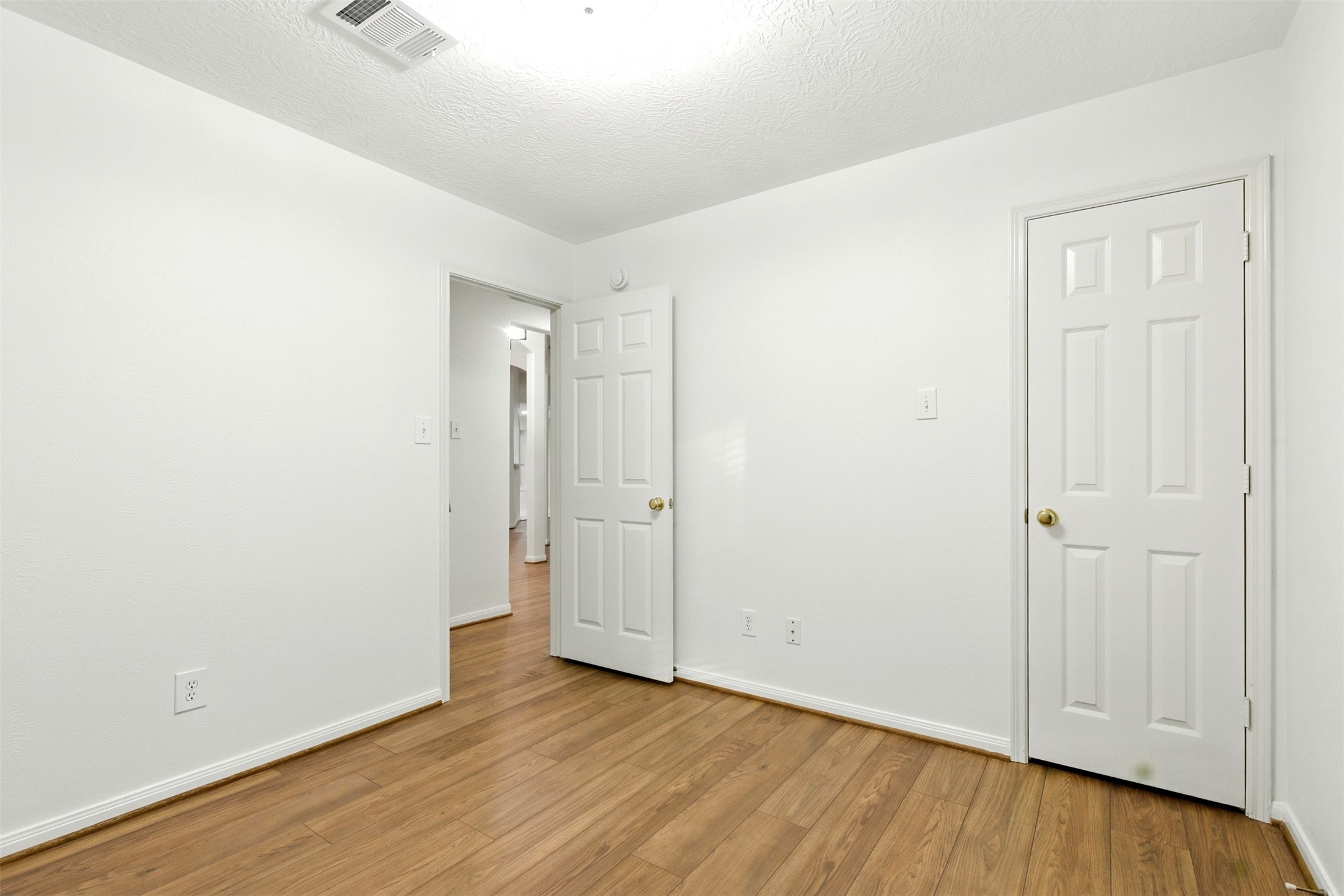 2119 Hannover Way Spring, TX 77388 - Photo 25 of 39 an empty room with wooden floor