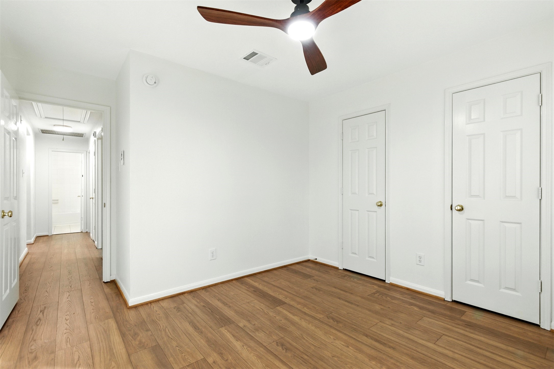 2119 Hannover Way Spring, TX 77388 - Photo 27 of 39 a view of an empty room with wooden floor