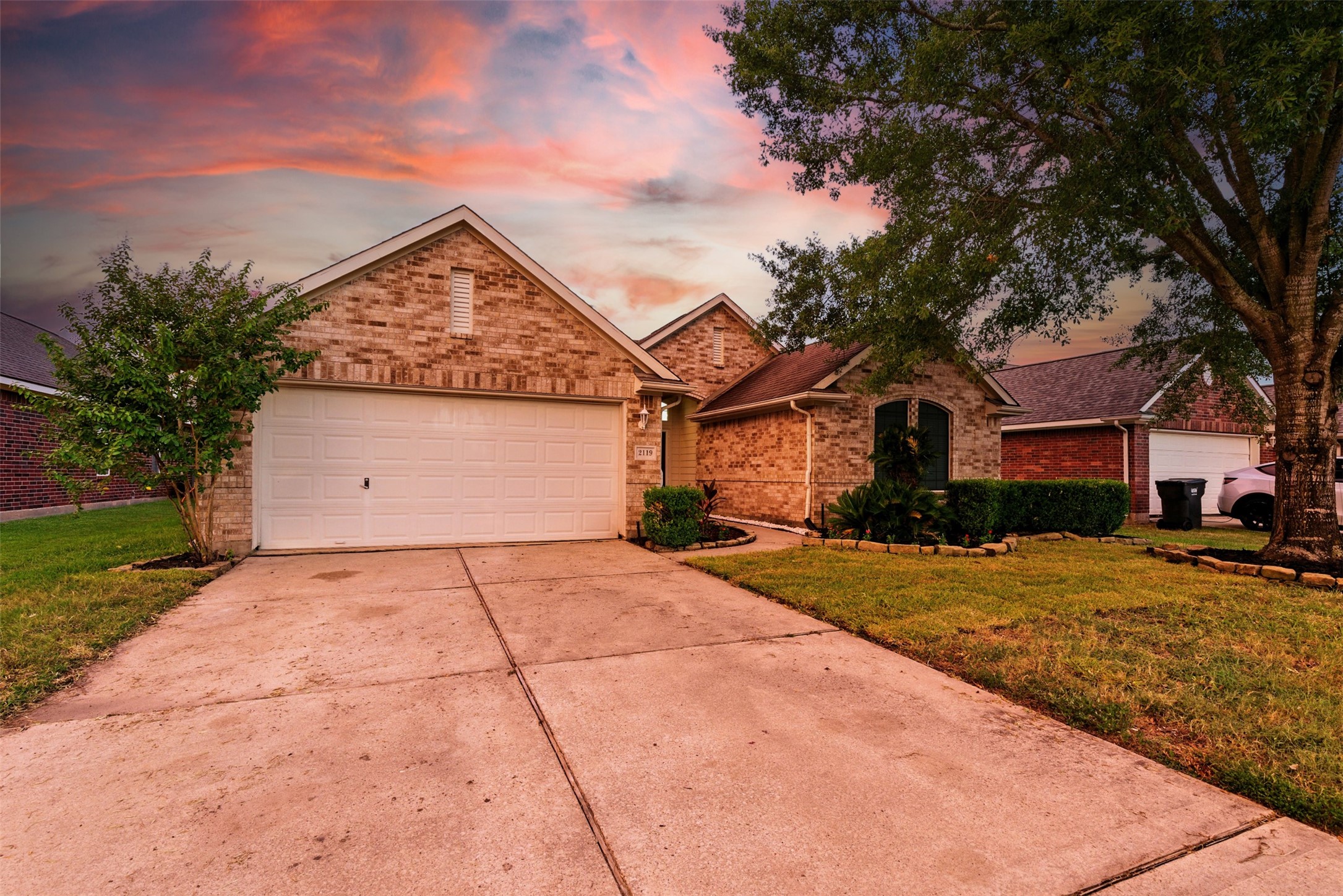 2119 Hannover Way Spring, TX 77388 - Photo 35 of 39 a front view of a house with a yard and garage